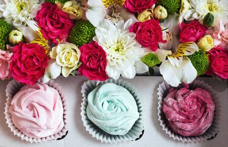 Rose marshmallows and beautiful flowers on a white background woの写真素材