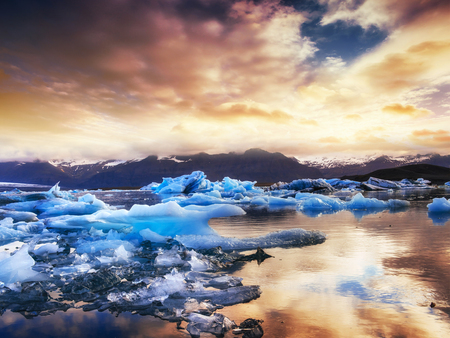 Jokulsarlon glacier lagoon, fantastic sunset on the black beach,の写真素材
