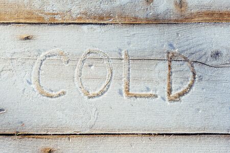 Writing on the snow. Wooden texture.の写真素材
