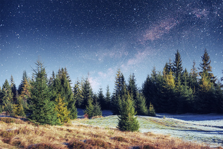fantastic winter meteor shower and the snow-capped mountainsの写真素材
