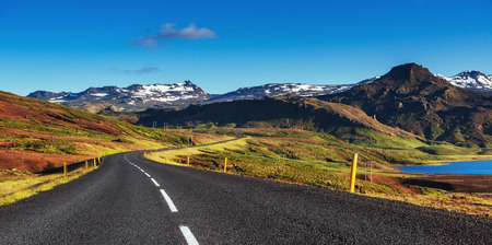 Road in mountains. Bridge over a channel connecting Jokulsarlonの写真素材