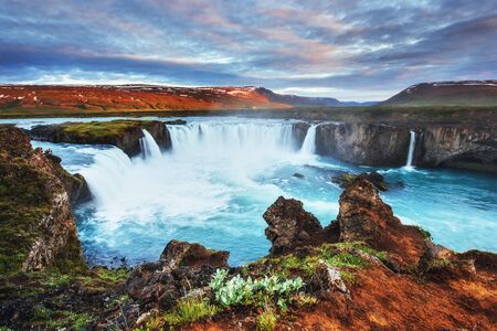 Godafoss waterfall at sunset. Fantastic landscape. Beautiful cumの写真素材