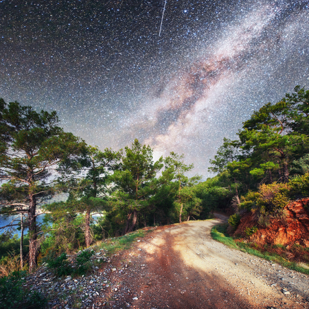 Fantastic starry sky and majestic mountains in the mist. Dramatic  beautiful morning. Autumn landscape.の写真素材