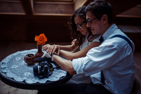 Romantic couple in love bonding in cafeの写真素材