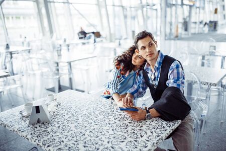 beautiful girl with a guy at the airport in the expected aircraftの写真素材