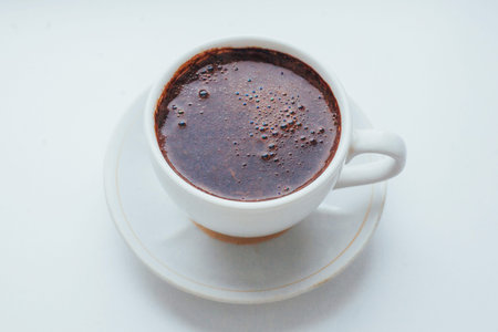 coffee cup over white background. The morning celebration.