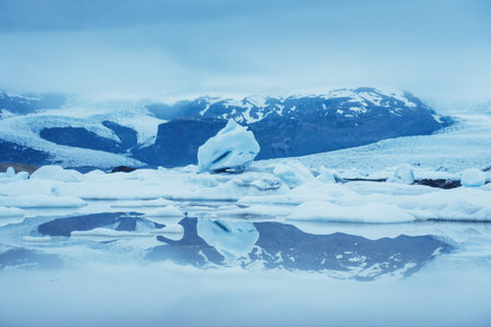 Jokulsarlon glacier lagoon, fantastic sunset on the black beach, Iceland.