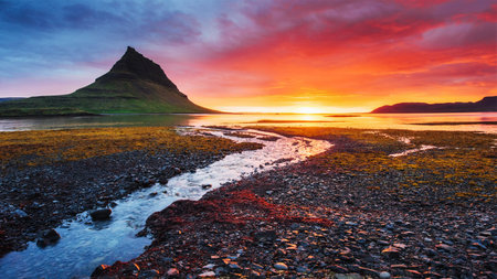 The picturesque sunset over landscapes and waterfalls. Kirkjufell mountain. Icelandの写真素材