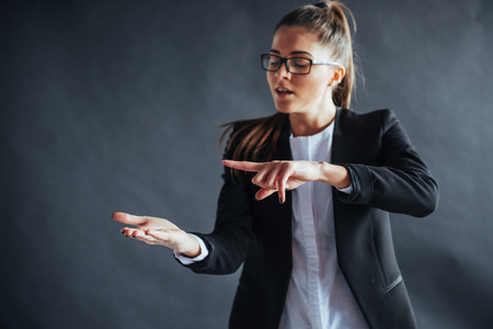 woman showing open hand palm with copy space for product or textの写真素材