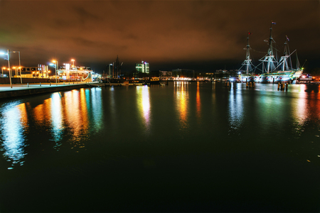 Night illumination of buildings and boats near the water in the canal.の写真素材