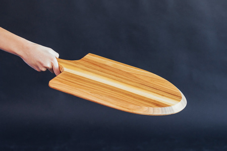 Wooden boards for pizza in hand womanの写真素材