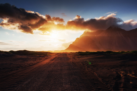 Fantastic west of the mountains and volcanic lava sand dunes on the beach Stokksness, Icelandの写真素材