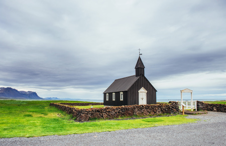 Mountain View Iceland. Beautiful black wooden church in Budir.の写真素材