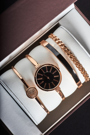 Golden woman watch on a white background in the box.の写真素材