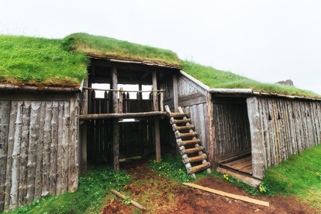 Traditional Viking village. Wooden houses near the mountain first settlements in Icelandの写真素材