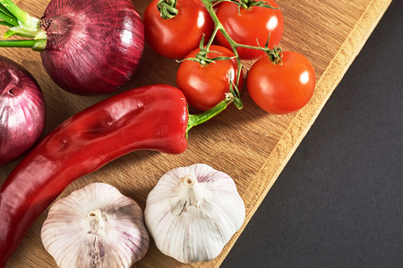 onion and garlic and hot peppers and tomatoesの写真素材