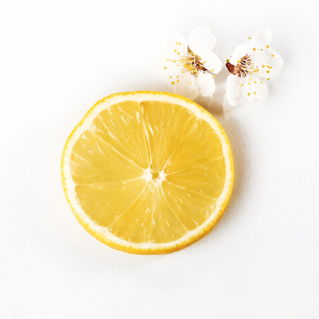 slice ripe lemon citrus fruit on a white backgroundの写真素材