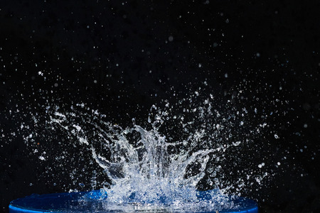 Beautiful blue water drops falling downの写真素材