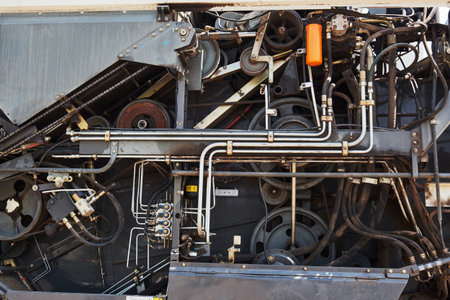 Harvesters and combine parts at the plant are waiting for sales, tractors and agricultural...