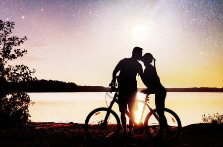 Couple on water background at night sky. Fantastic starry sky and the milky way.の写真素材