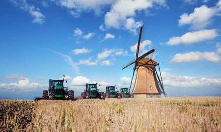 The road leading to the Dutch windmills from the agro field. Holland.の写真素材