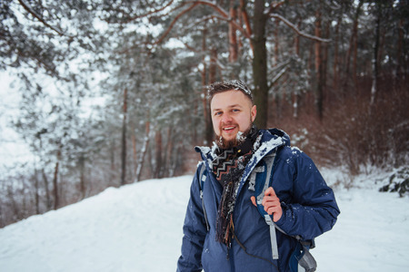 Man Traveler with backpack hiking Travel Lifestyle adventure concept active vacations outdoor. Beautiful landscape  forestの写真素材
