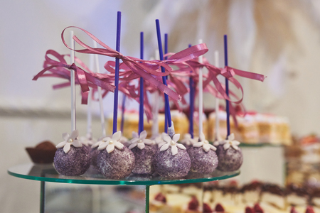 delicious colorful cookies and cakes on the wedding candy bar.の写真素材