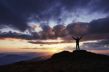Silhouette of man praying over beautiful sky background.の写真素材