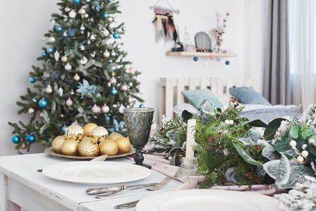 Table served for Christmas dinner in living room, close up view.の写真素材