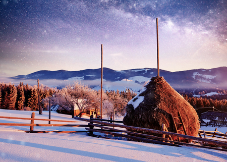 Amazing mountains in the morning sunlight. Small cozy village. Carpathian, Ukraine, Europe. Beauty world. Happy New Year.の写真素材