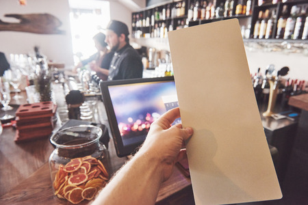 Mock up Menu frame on Table in Bar restaurant cafe Background.の写真素材