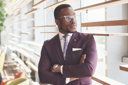 A beautiful young African American who thinks about a serious idea. Confident in making business...