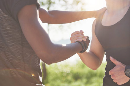 Close up view of friends hands. Supporting each other. On the beautiful beach.