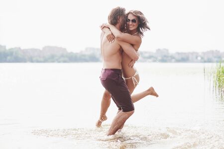 steam running along the water, beautiful summer beachの写真素材