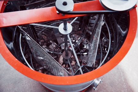 Honey extractor with honeycomb wax with honey frame.の写真素材