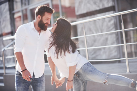 Beautiful happy couple hugging on the city street.Lifestyle concept love and romance.