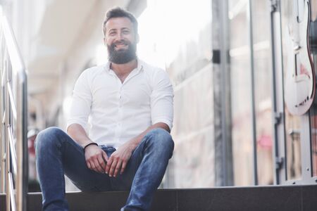 Beautiful happy couple hugging on the city street.Lifestyle concept love and romance.の写真素材