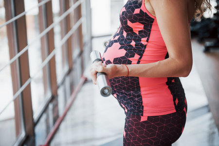 Conception of pregnancy, sports, fitness and healthy lifestyle in the gym