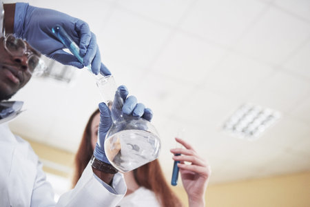 Experiments in the chemical laboratory. An experiment was carried out in a laboratory in transparent...