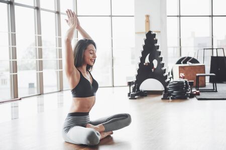 A sports girl doing a stretch. A woman tries to be in good shape.の写真素材