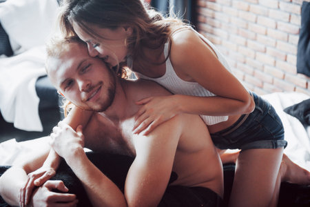 Sensual relationships, husband and wife play in bed