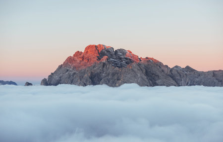 Sun leaving the place. It is visible on the disappearing lights. The peaks of the mountains stifle...