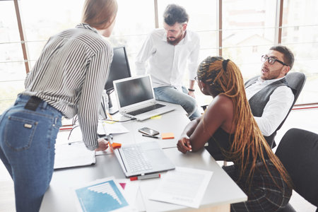 Believe me, it will be good for us. Team workers have meeting and talking about planning their...