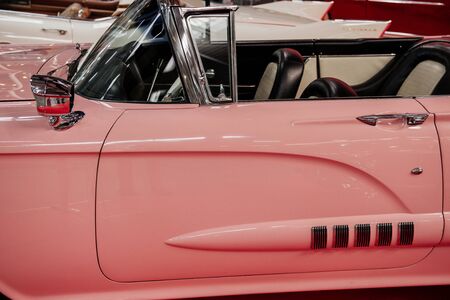 SINSHEIM, GERMANY - OCTOBER 16, 2018: Technik Museum. Side view of the rare pink cabriolet. Beautiful classic.のeditorial素材