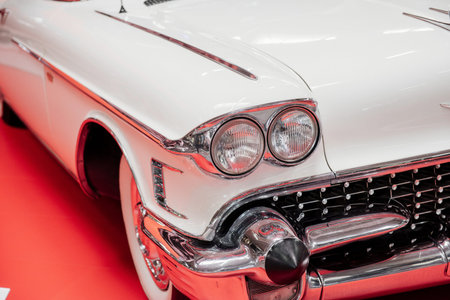 SINSHEIM, GERMANY - OCTOBER 16, 2018: Technik Museum. Front part of the white retro car standing on the red surface.のeditorial素材