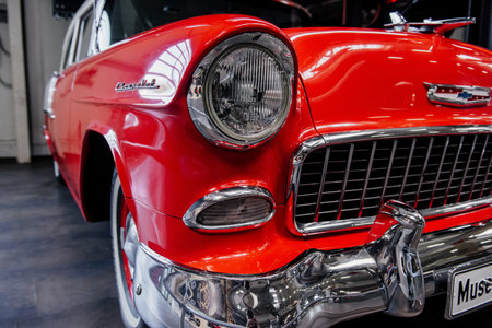 SINSHEIM, GERMANY - OCTOBER 16, 2018: Technik Museum. Close up photo. Front and right side of the red retro car. Perfectly polished.のeditorial素材