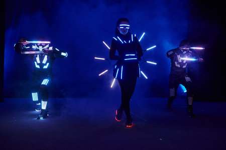 Laser show performance, dancers in led suits with LED lamp, very beautiful night club performance,...