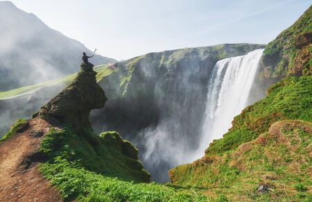 Great waterfall Skogafoss in south of Iceland near the town of Skogar. Dramatic and picturesque scene.の写真素材