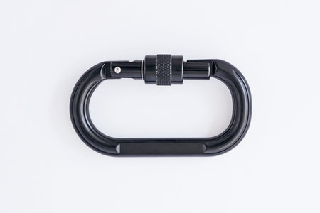 Ready for use. Isolated photo of climbing equipment - black colored part of carabiner.