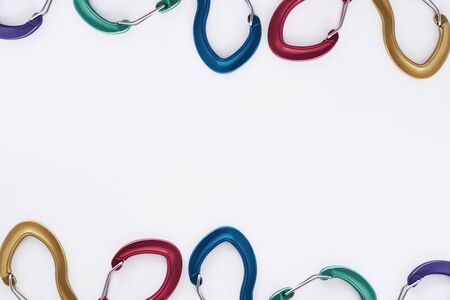 Gorgeous background. Top view. Climbing equipment for the safeness lying on the white table. Conception of extreme sports.の写真素材